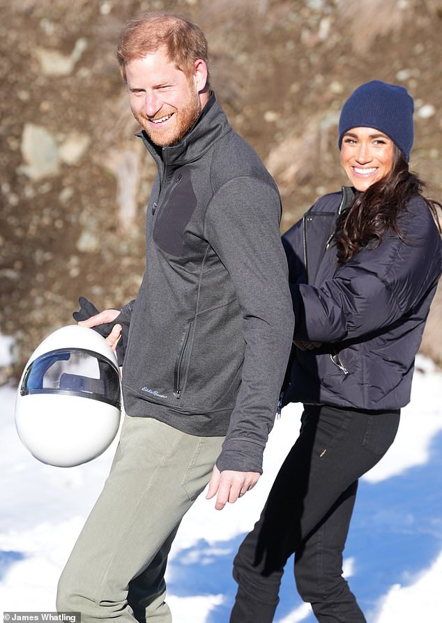 Meghan beamed with pride as her husband recounted his trip around the track yesterday