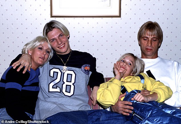 He says of the situation: 'It's years and years of crying wolf [from Jane and Bob], I am mad at both of them! If this is a serious situation I'm gonna take it seriously' (pictured Nick and Aaron with their parents in 1997)