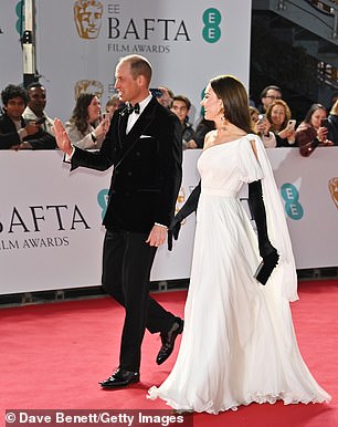 The Prince of Wales was grinning as he waved to royal fans who had lined the red carpet waiting for the couple