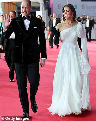 The Prince of Wales was grinning as he waved to royal fans who had lined the red carpet waiting for the couple