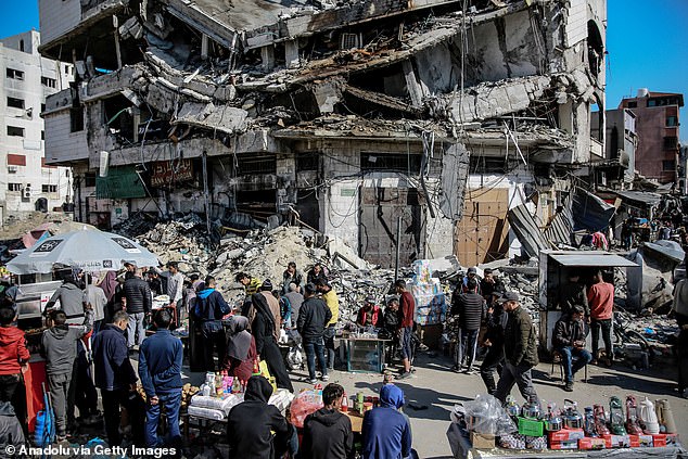 Hawkers are seen selling what little food and basic life necessities they have left on the streets as Palestinians struggle with the rising cost of living due to Israeli attacks in Gaza City on February 14, 2024