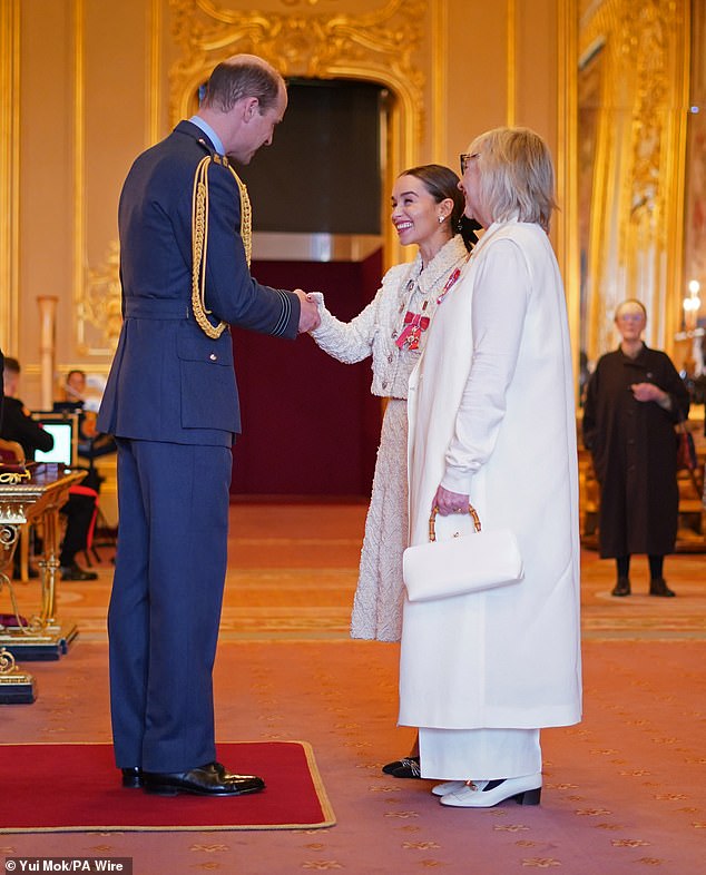 Game of Thrones star Emilia Clarke (centre) said William made her and her mother feel 'so comfortable' while he presented them with their honours