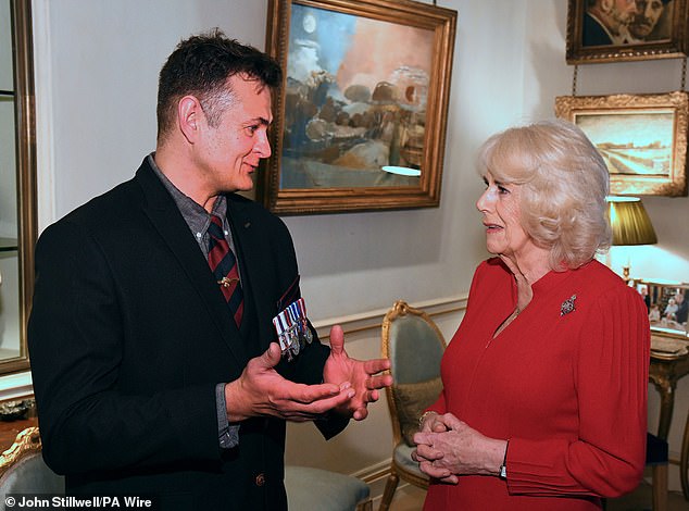 Lance Sgt Markus Strydom MC (left) appeared animated as he chatted with the Queen at today's event