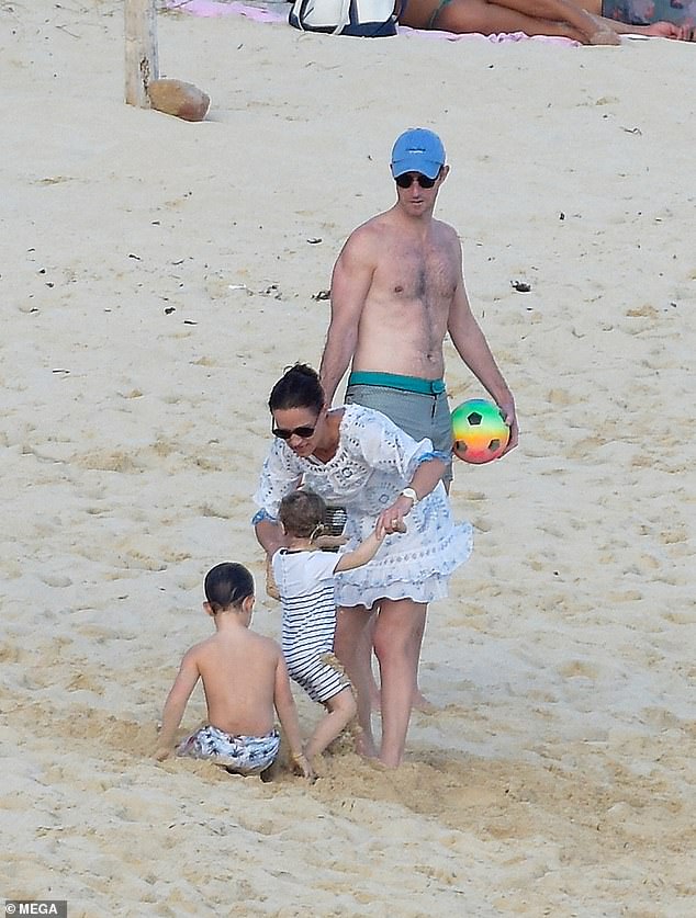 James, a former racing driver, matched his wife in a pair of blue swimming trunks, and looked to have caught the sun on their trip to the Caribbean