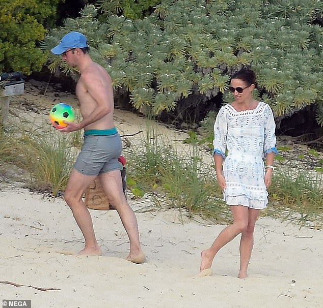 The family brought a selection of beach toys with them for the day, including a bright football