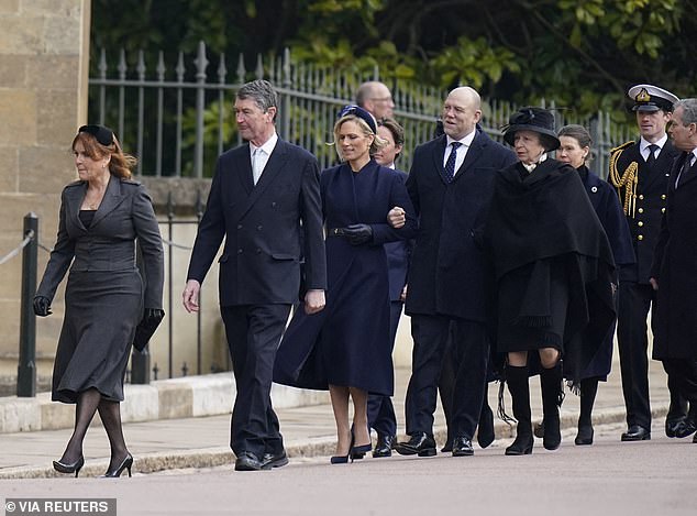 Zara Tindall, 42, looked windswept yet elegant as she arrived at St George's Chapel arm-in-arm with her rugby ace husband Mike, 45, her mother Princess Anne and stepfather Vice Admiral Sir Tim Laurence