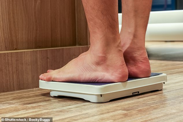 Men DO get fatter after they get married because they eat more and exercise less after tying the knot, scientists say