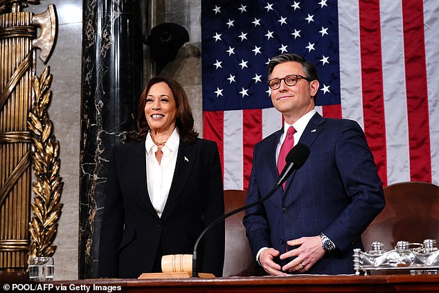 Speaker of the House Mike Johnson (right) and Vice President Kamala Harris (left) stand in the House of Representatives