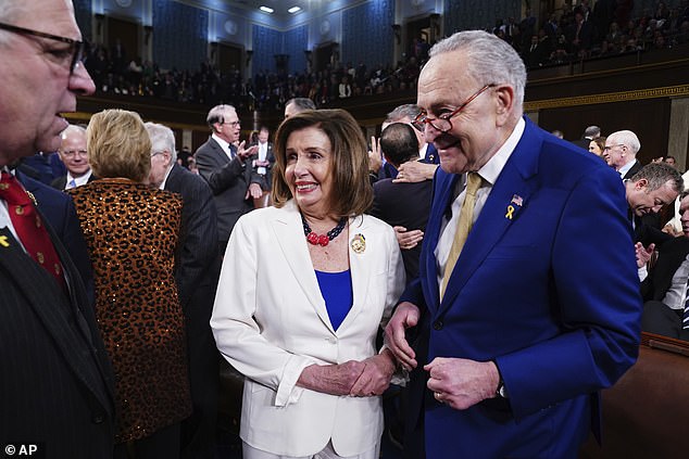 Senate Majority Leader Chuck Schumer, Democrat of New York, speaks with Rep. Nancy Pelosi (D-California) prior to President Joe Biden's State of the Union address