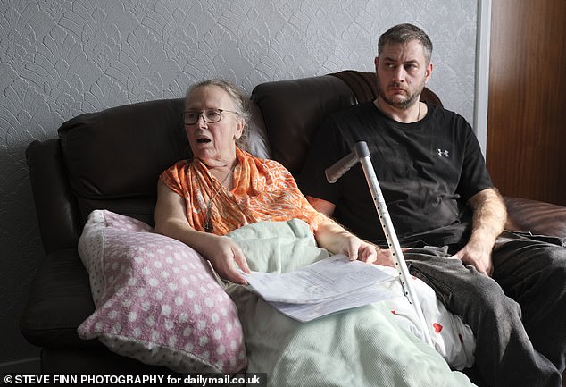 Speaking to MailOnline at her friend's home where she has taken refuge, Sheena sat looking weary on a leather sofa with a blanket over her lap and a metal walking stick resting to her side