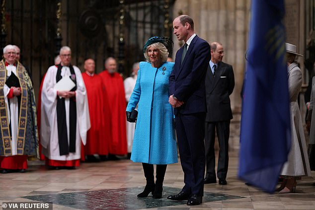 Queen Camilla stands with the Prince of Wales at Westminster Abbey