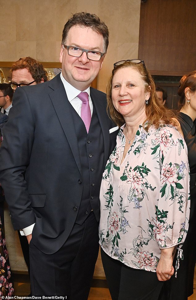 Angela later posed with Former CEO of Fortnum & Mason Ewan Venters