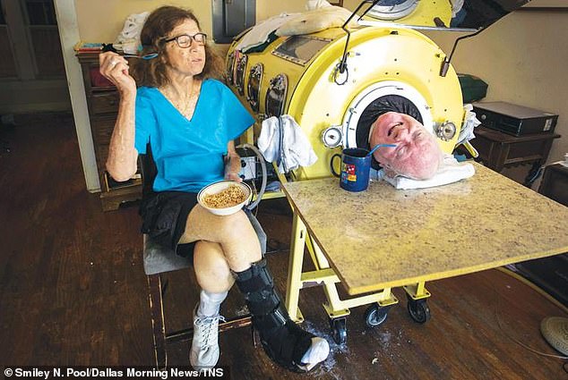 At 78, Mr Alexander lived long after the invention of the polio vaccine in the 1950s all but eradicated the disease in the Western world. Pictured, Paul Alexander and Kathy Gaines, his carer of 30 years, who he met from a newspaper advert