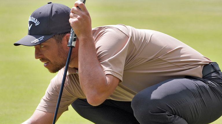 Xander Schauffele lines up his putt on the second hole during the final round of The Players Championship golf tournament Sunday, March 17, 2024, in Ponte Vedra Beach, Fla. (AP Photo/Marta Lavandier)