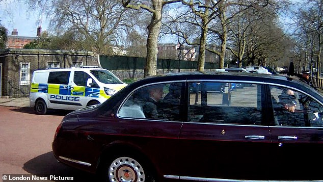 Members of the public watched in central London as the King went past in his car