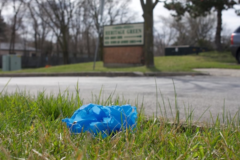 A discarded shoe cover sits outside of Heritage Green Nursing Home.