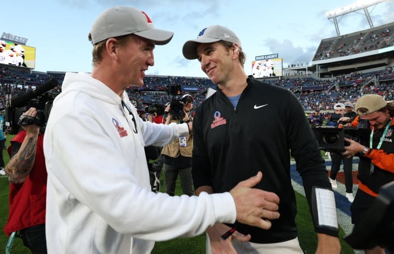 Eli Manning and brother Peyton Manning are seen at the 2024 Pro Bowl, in Orlando, Fla., in February 2024.