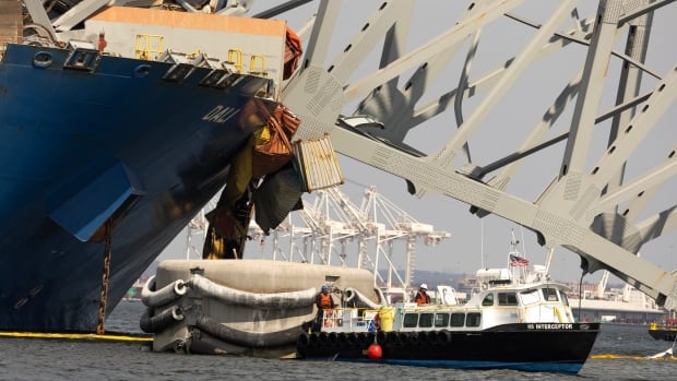 Crews begin careful process of removing steel from collapsed Baltimore bridge