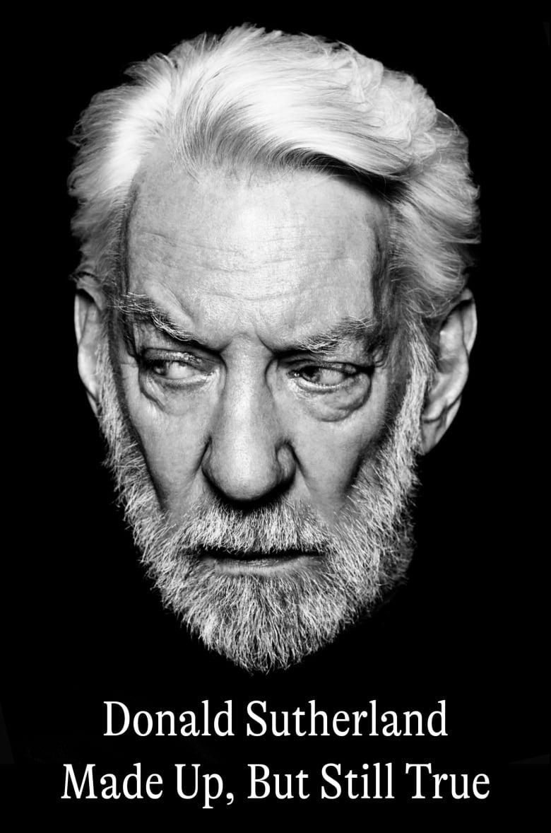 A man with a full white beard and white hair in a black and white photo.