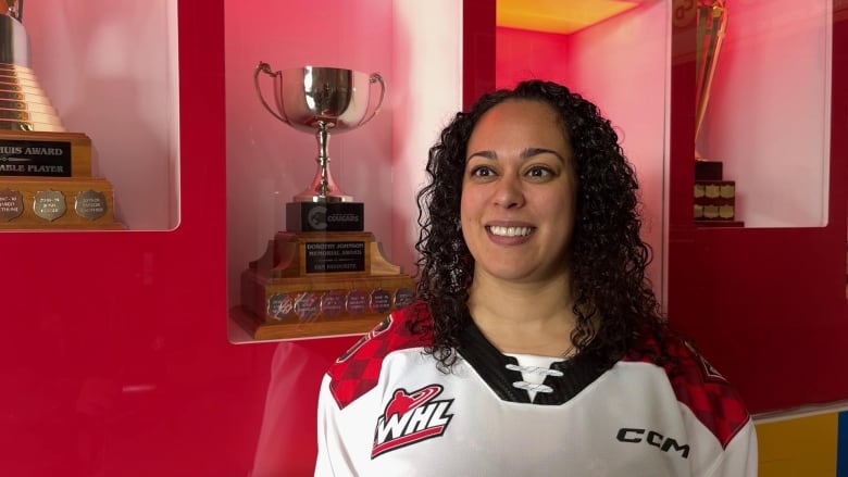 A woman in a hockey jersey.