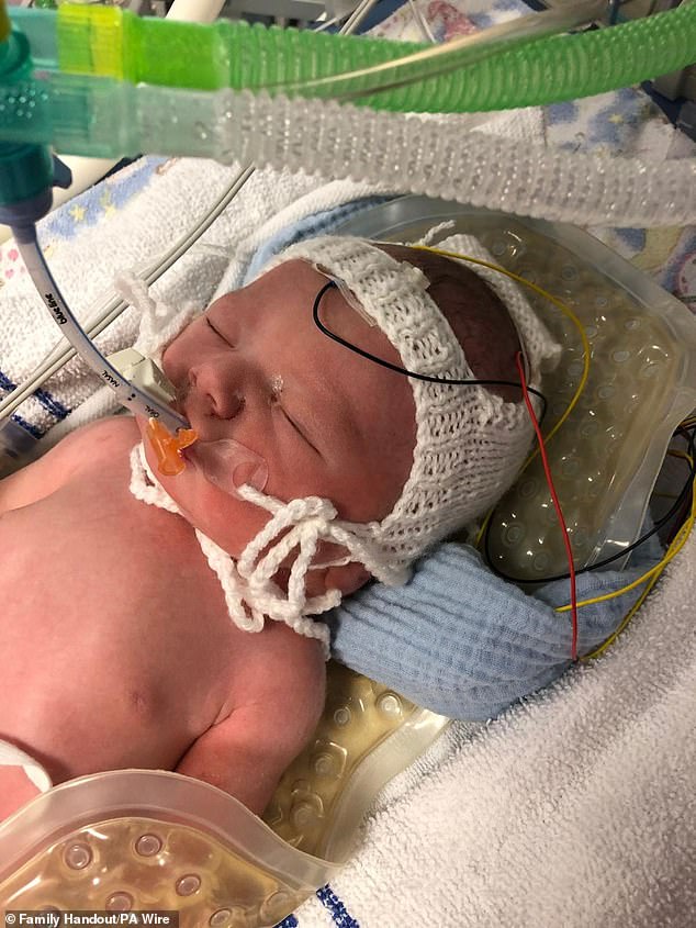 Mother whose newborn baby died at NHS hospital where she had worked as a midwife pleaded for help from a doctor moments before she started fitting, inquest hears