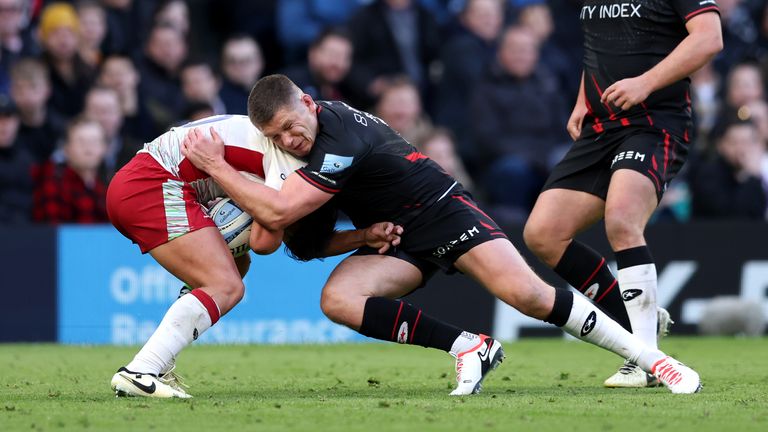 Owen Farrell tackles Marcus Smith