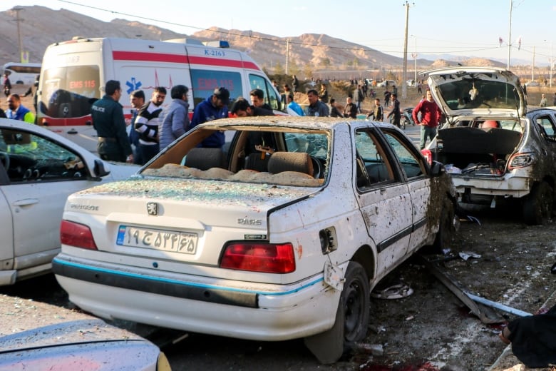 Destroyed cars are seen in the aftermath of an explosion in Kerman, Iran, on Jan. 3, 2024.