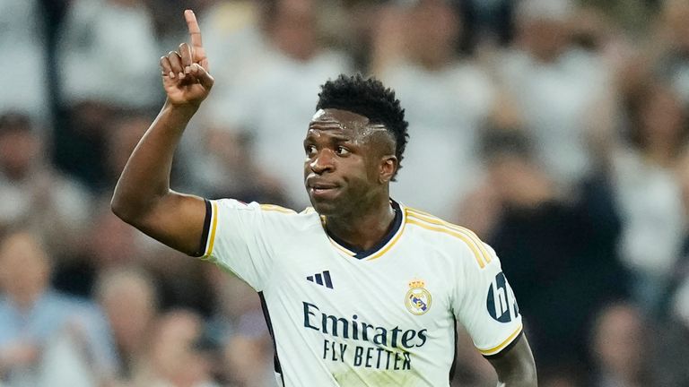 Real Madrid's Vinicius Junior celebrates after scoring his side's first goal during the Spanish La Liga soccer match between Real Madrid and Barcelona at the Santiago Bernabeu stadium in Madrid, Spain, Sunday, April 21, 2024. (AP Photo/Jose Breton)