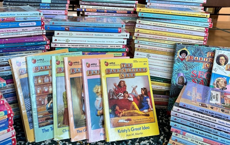 Stacks of books from the Baby-Sitters Club series