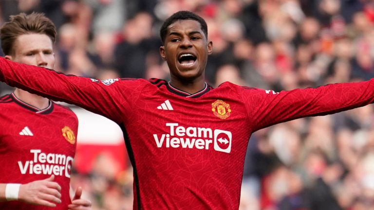 Marcus Rashford celebrates after scoring his side's second goal from the penalty spot