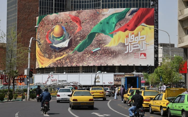 A pro-Palestinian poster is seen on display in Tehran, Iran.