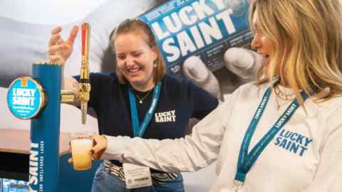 Women pour Lucky Saint beverages