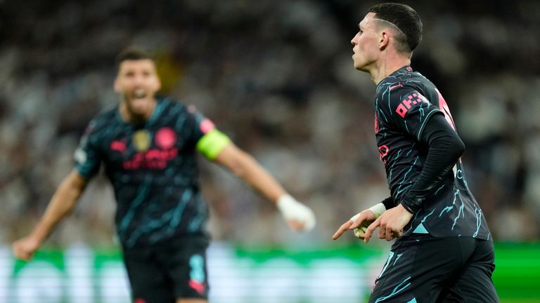 Manchester City's Phil Foden celebrates after scoring his side's second goal during the Champions League quarterfinal first leg soccer match between Real Madrid and Manchester City at the Santiago Bernabeu stadium in Madrid, Spain, Tuesday, April 9, 2024. (AP Photo/Jose Breton)