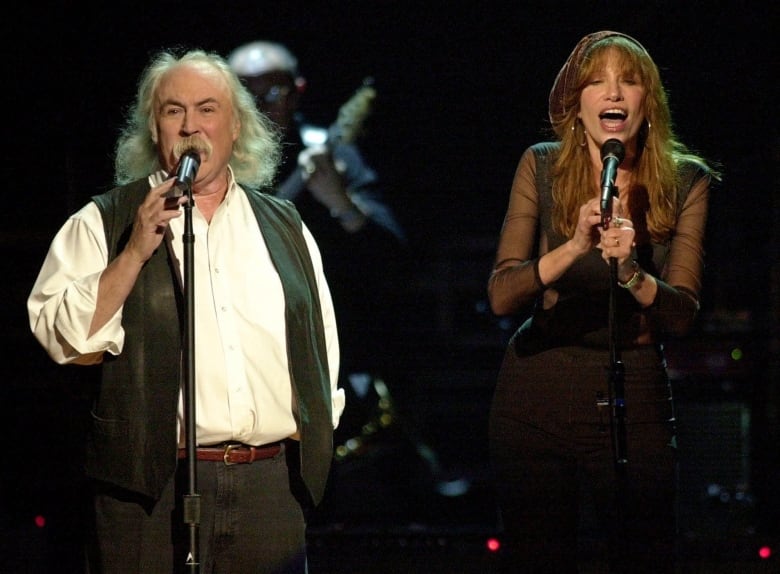 A man and a woman sing together at a tribute concert in honour of Brian Wilson.