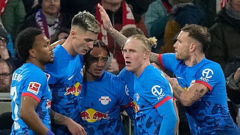 Benjamin Sesko (2nd left) celebrates with team-mates after bringing Leipzig level against Bayern