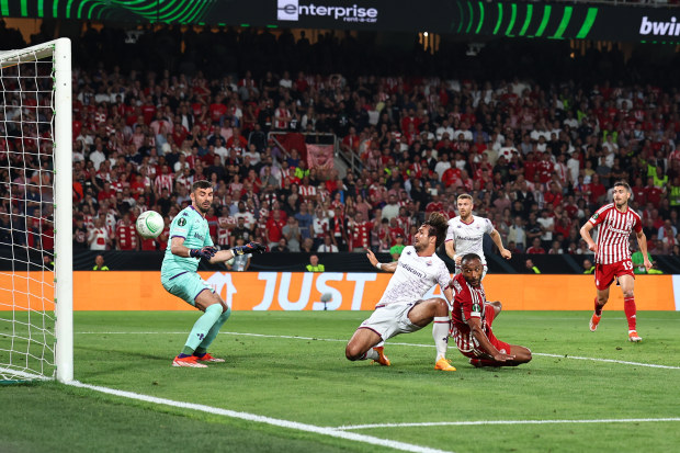 Ayoub El Kaabi of Olympiakos scores a goal at AEK Arena.