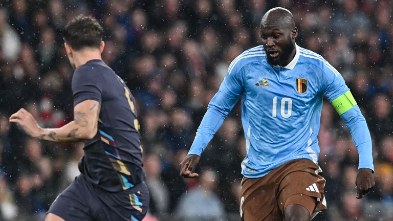 Romelu Lukaku takes on John Stones