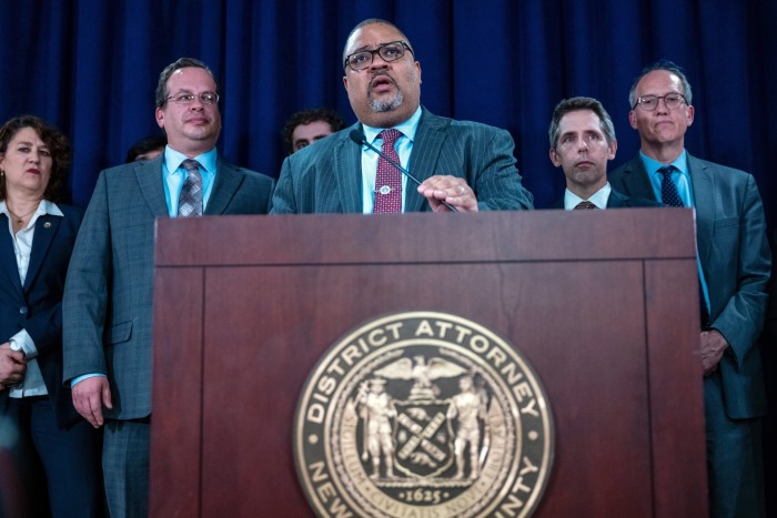 Manhattan district attorney Alvin Bragg stands with members of his staff at a news conference following the conviction of Donald Trump in his hush money trial on May 30, 2024 in New York City