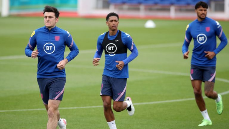 Harry Maguire with Jude Bellingham during England training on Thursday (PA)