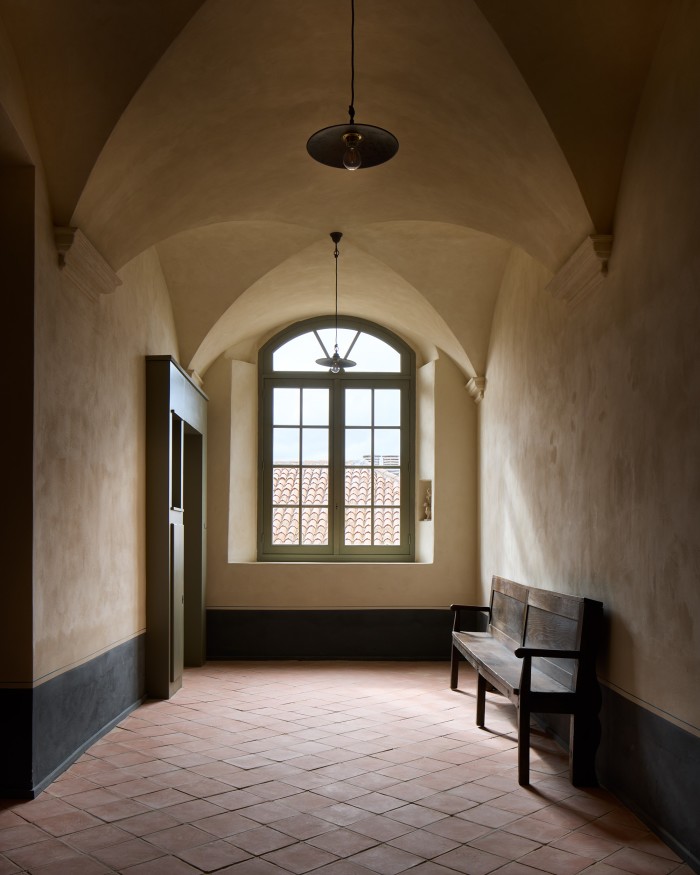 A tiled hallway in the convent