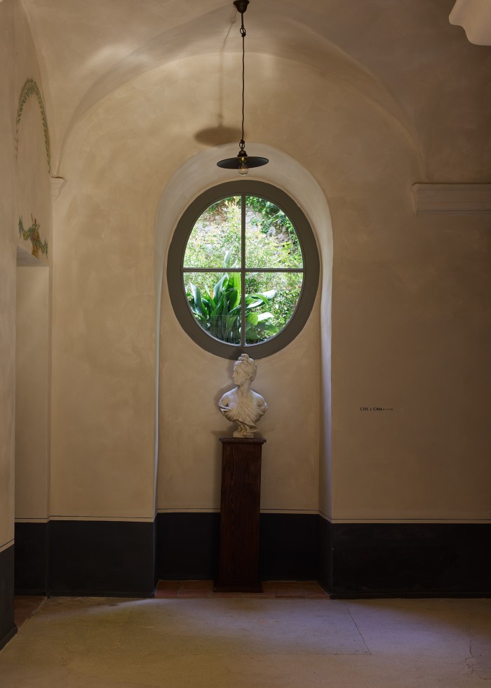 A 19th-century marble bust of Diane, after Houdon, in the east wing of the convent hallway