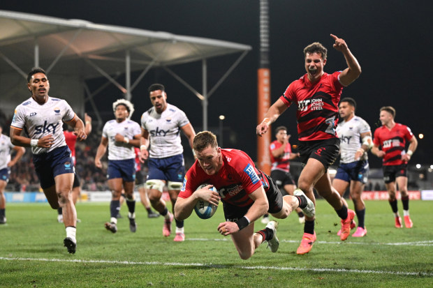 Dallas McLeod of the Crusaders scores a try.