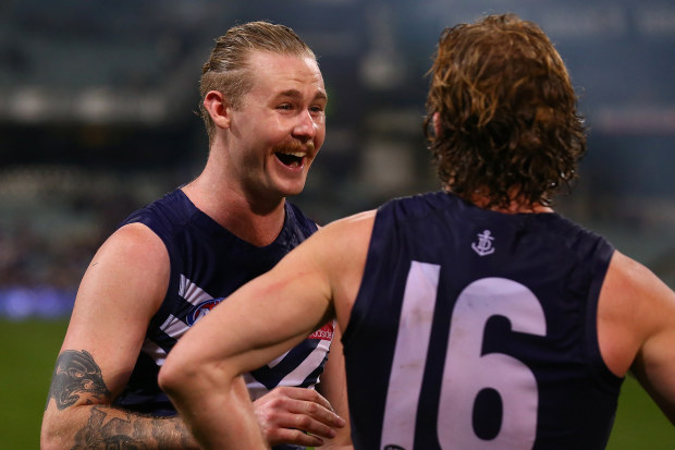 Cam McCarthy of the Dockers shares a moment with David Mundy after winning the round 20 AFL match between the Fremantle Dockers and the Gold Coast Suns at Domain Stadium on August 5, 2017 in Perth, Australia. (Photo by Paul Kane/Getty Images)