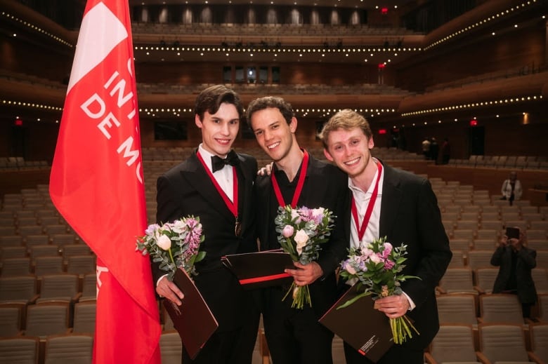 From left: Jaeden Izik-Dzurko (1st prize), Gabriele Strata (2nd prize) and Anthony Ratinov (3rd prize) pose onstage following the final round of the 2024 Montreal International Music Competition.