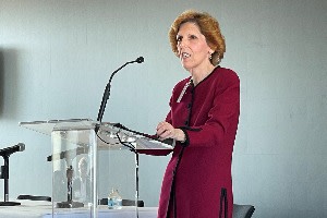 Loretta Mester speaks at a conference