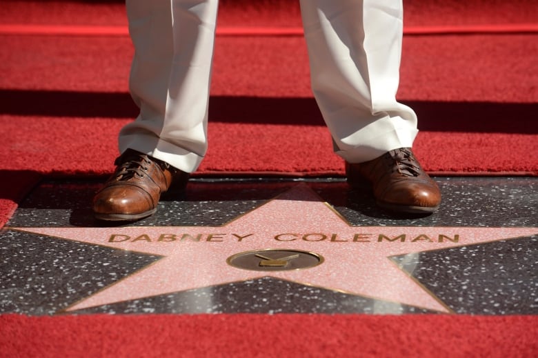 Dabney Coleman stands on his star on the Hollywood Walk of Fame in Los Angeles November 6, 2014.