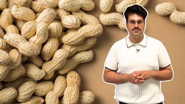 CBC's Gabriel Guindi poses in the foreground with an image of peanuts in their shells spread on a table in the background