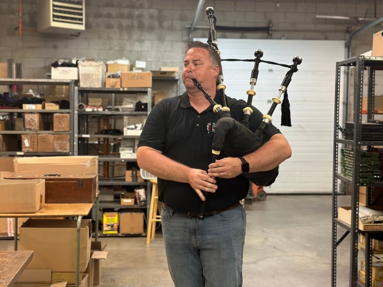 Wayne Cartier assembles, tests, and tunes all the bagpipes at Scott's Highland Services in London. The wholesaler is one of southern Ontario's largest and sells to more than 30 countries worldwide. Here is Cartier pictured playing a Highland pipe. 