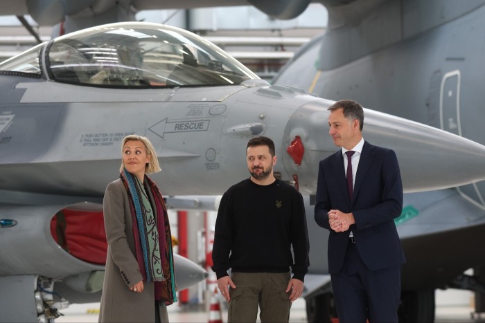 Volodymyr Zelenskyy is flanked by Belgian defence minister Ludivine Dedonder and prime minister Alexander De Croo