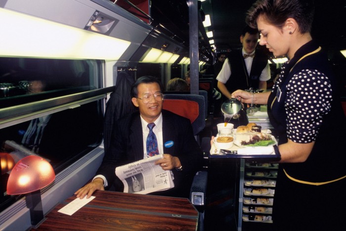 A passenger enjoys a meal on a Eurostar journey in 1994